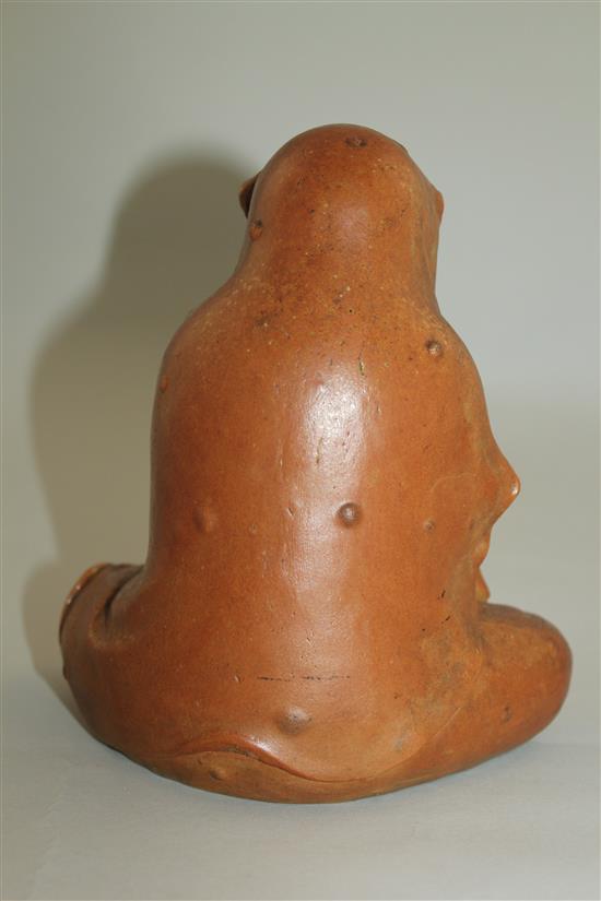 A Japanese stoneware seated figure of Daruma, 19th century, 18.5cm